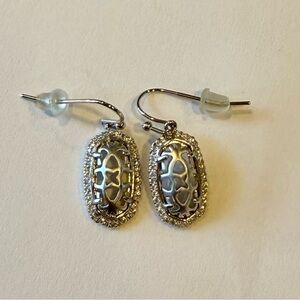 Kendra Scott silver toned drop filigree earrings.